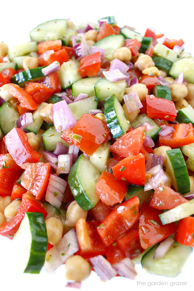 Greek-style chopped salad with chickpeas and dressing