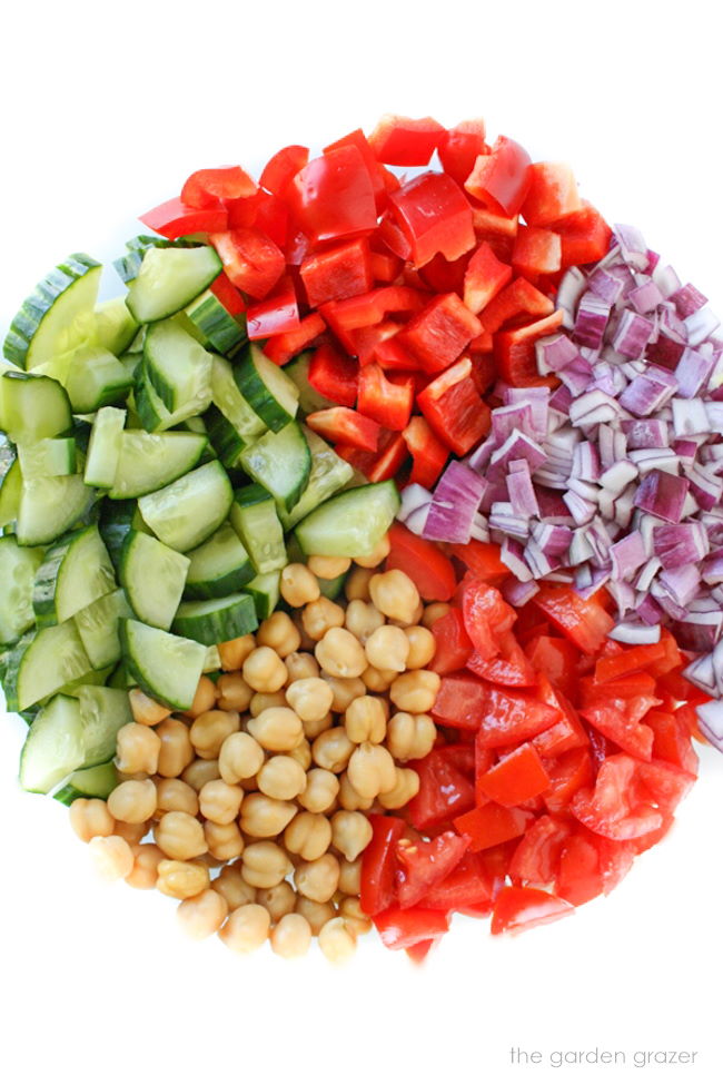 Raw chopped ingredients in a large glass bowl