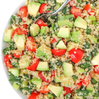 Quinoa Avocado Spinach Power Salad in a bowl with spoon