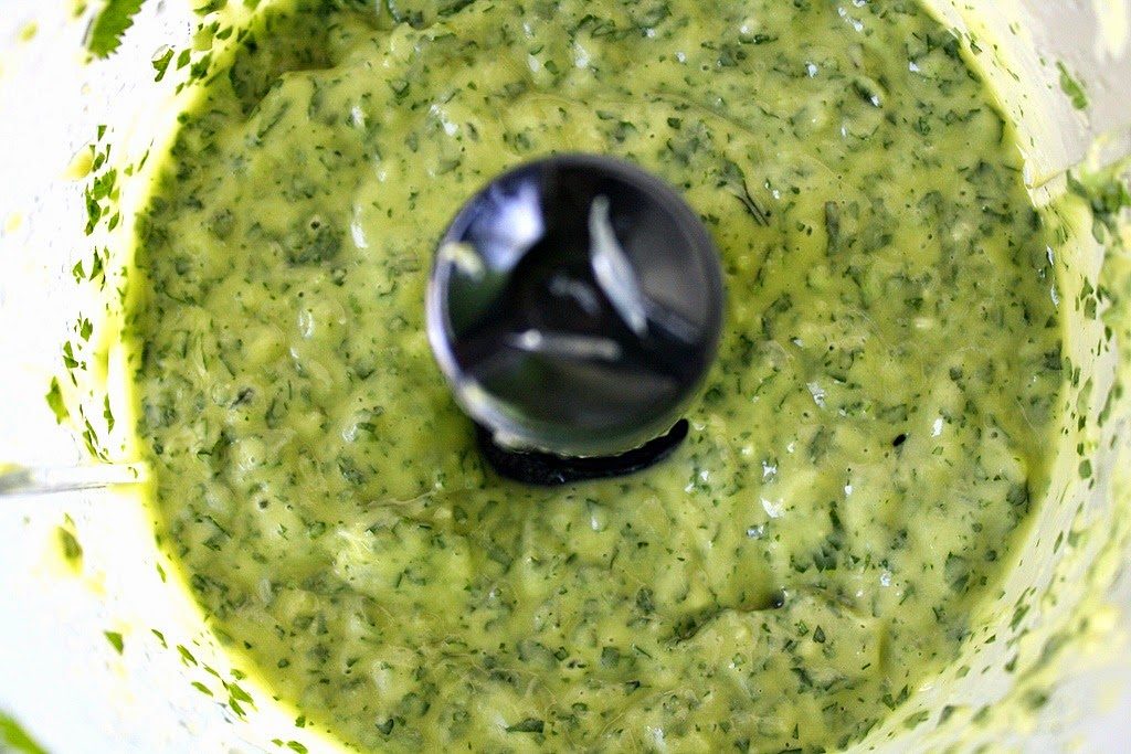Creamy vegan avocado cilantro sauce in food processor