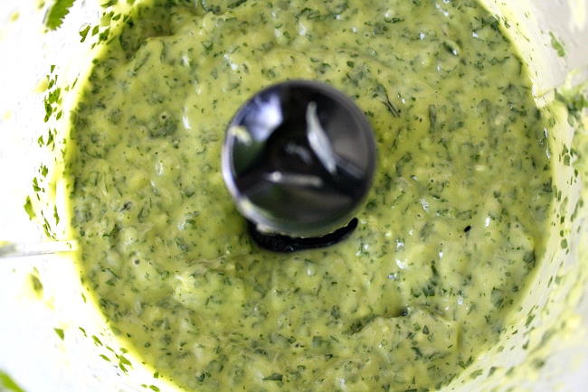 Creamy vegan avocado cilantro sauce in food processor