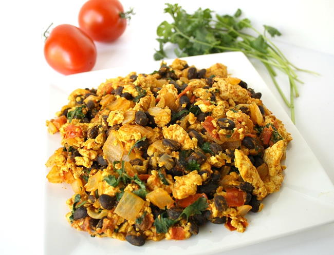 Plate with southwestern tofu scramble with tomato and cilantro