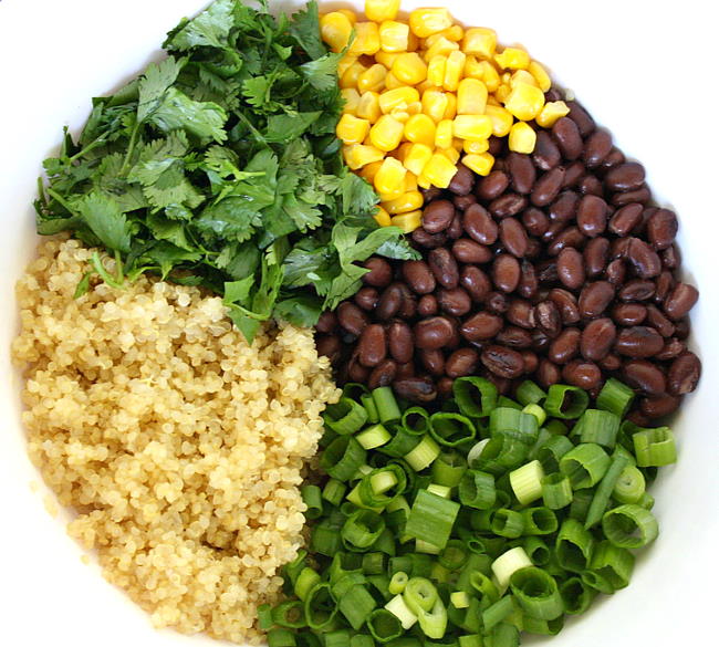 Quinoa, corn, and cilantro ingredients in a bowl