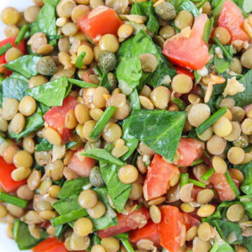 Bowl of Lentil Balsamic Salad with spinach and capers