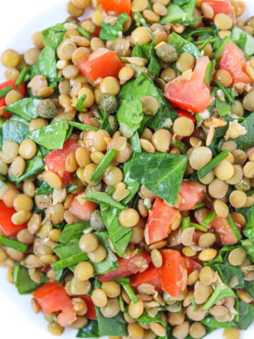 Bowl of Lentil Balsamic Salad with spinach and capers