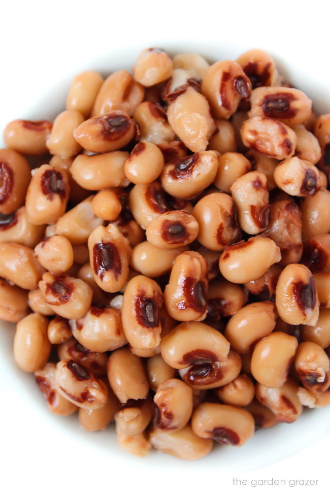 Cooked black eyed peas in a small white bowl