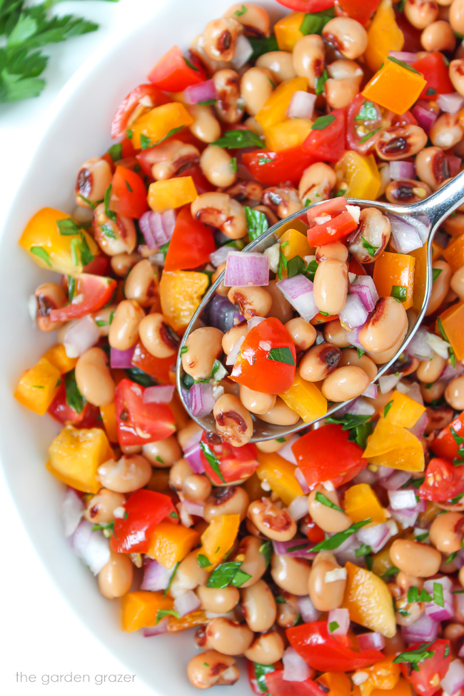 Vegan black eyed pea salad in a bowl with spoon