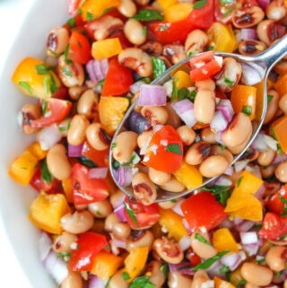 Vegan black eyed pea salad in a bowl with spoon