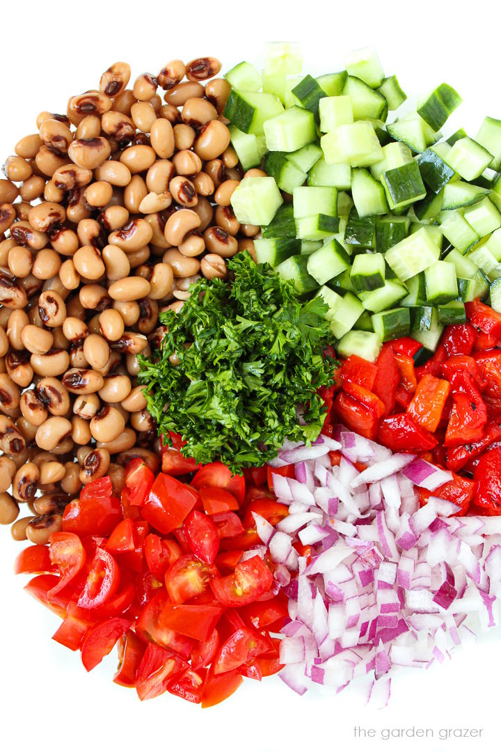 Chopped ingredients in a bowl before mixing for black eyed pea salad