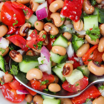 Close up view of black eyed pea salad with fresh veggies and herbs