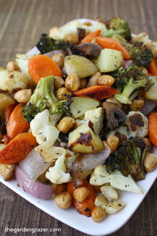 Roasted vegetables with chickpeas on a white plate