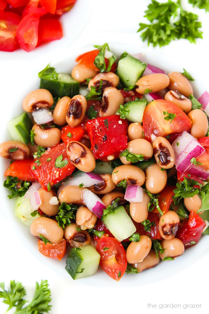 Zoomed in view of oil-free black-eyed pea salad in a small white bowl