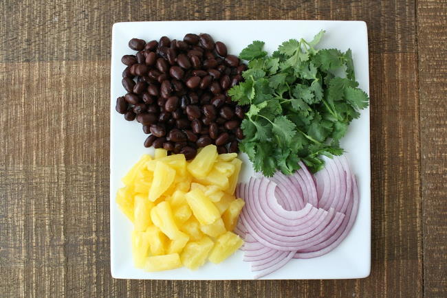 Topping ingredients for BBQ pizza on a plate