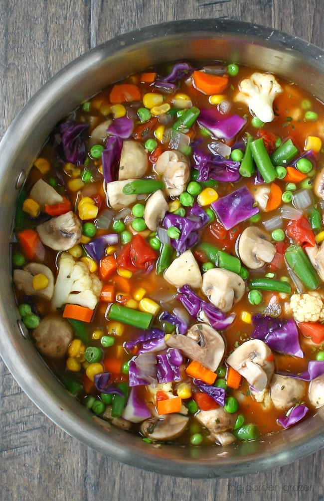 Vegan vegetable soup cooking in a large stockpot