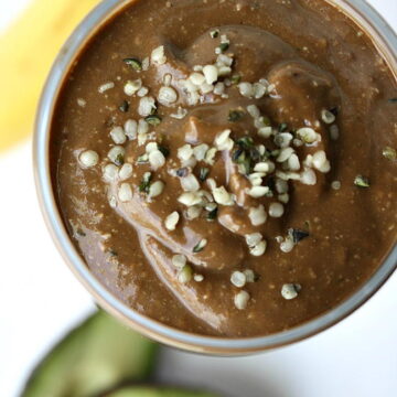 Overhead view of chocolate hemp smoothie in a glass