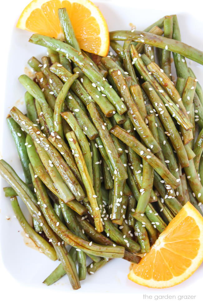 Plate of hoisin roasted green beans with orange