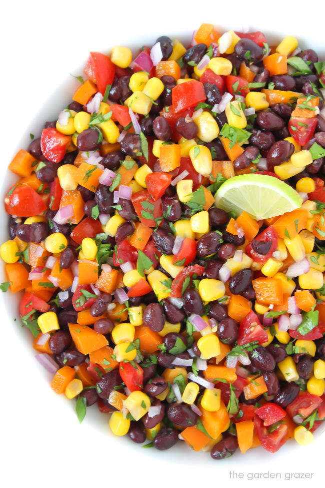 Bowl of black bean corn salsa with lime