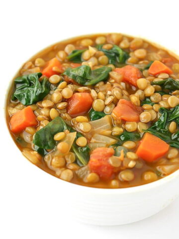 Bowl of vegan lentil spinach soup