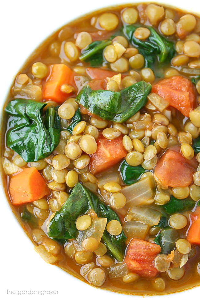 Close-up view of lentil spinach soup in a bowl