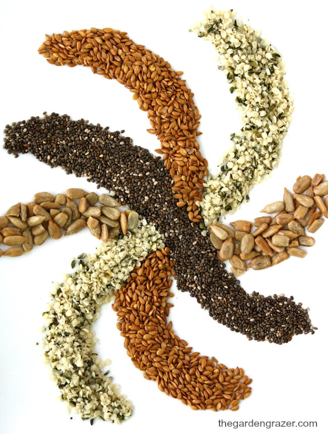 Ingredients on a white cutting board for super seed granola