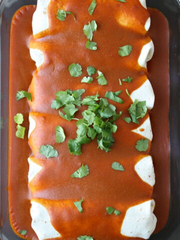 Vegan plant protein enchiladas in a large glass dish