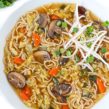 Bowl of Asian-style Noodle Soup with mushrooms and carrots