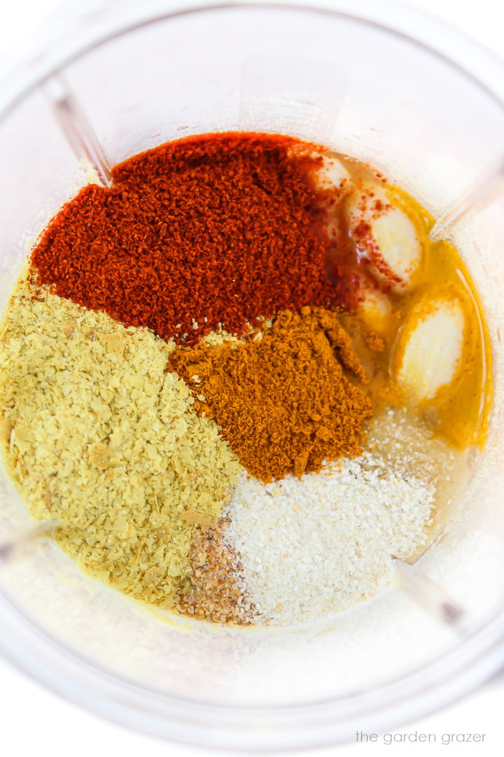 Ingredients in a blender for cashew cheese sauce before blending