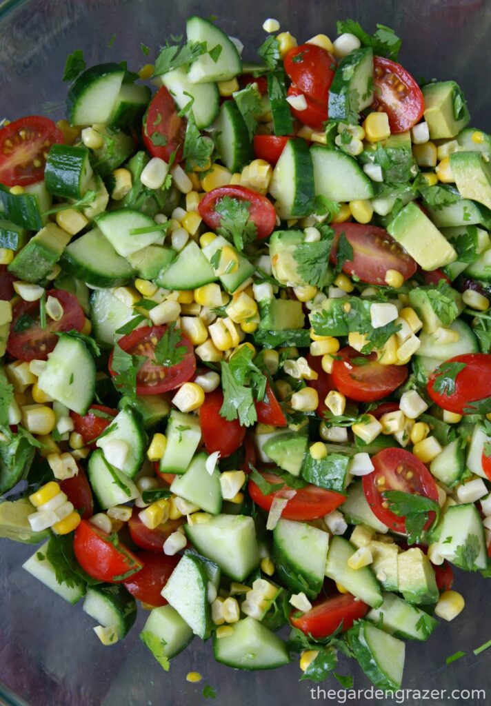 Summer blast salad in a bowl with corn, tomato, cucumber