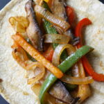 Vegan portobello mushroom fajitas on a corn tortilla