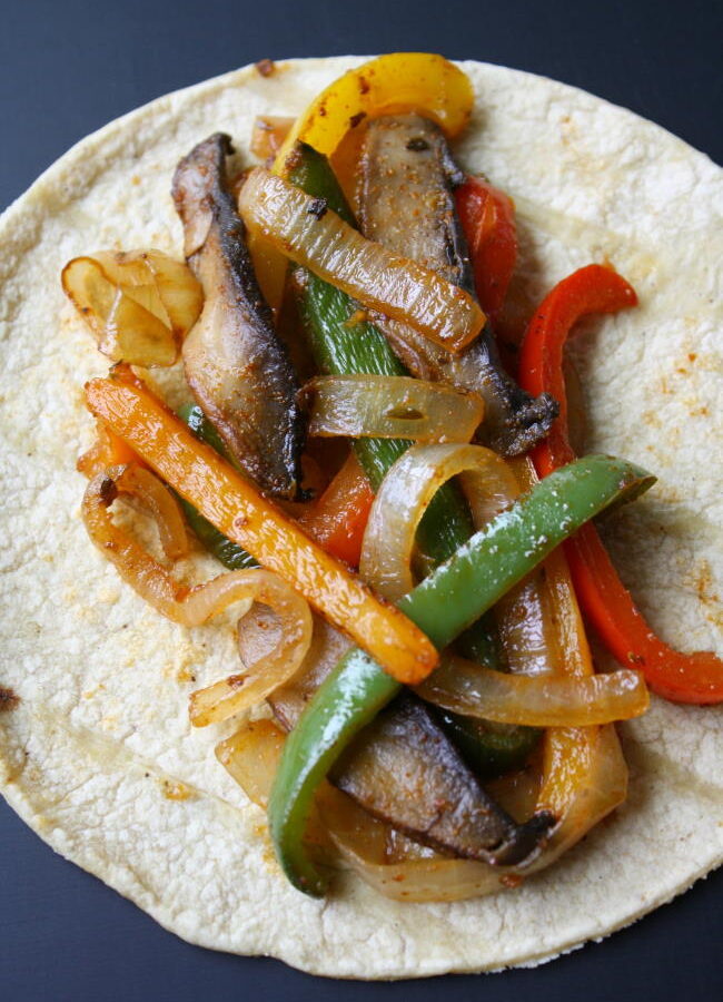 Vegan portobello mushroom fajitas on a corn tortilla