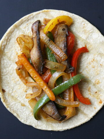 Portobello mushroom fajitas on a corn tortilla