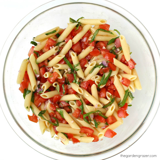Fresh tomato basil pasta in a glass bowl