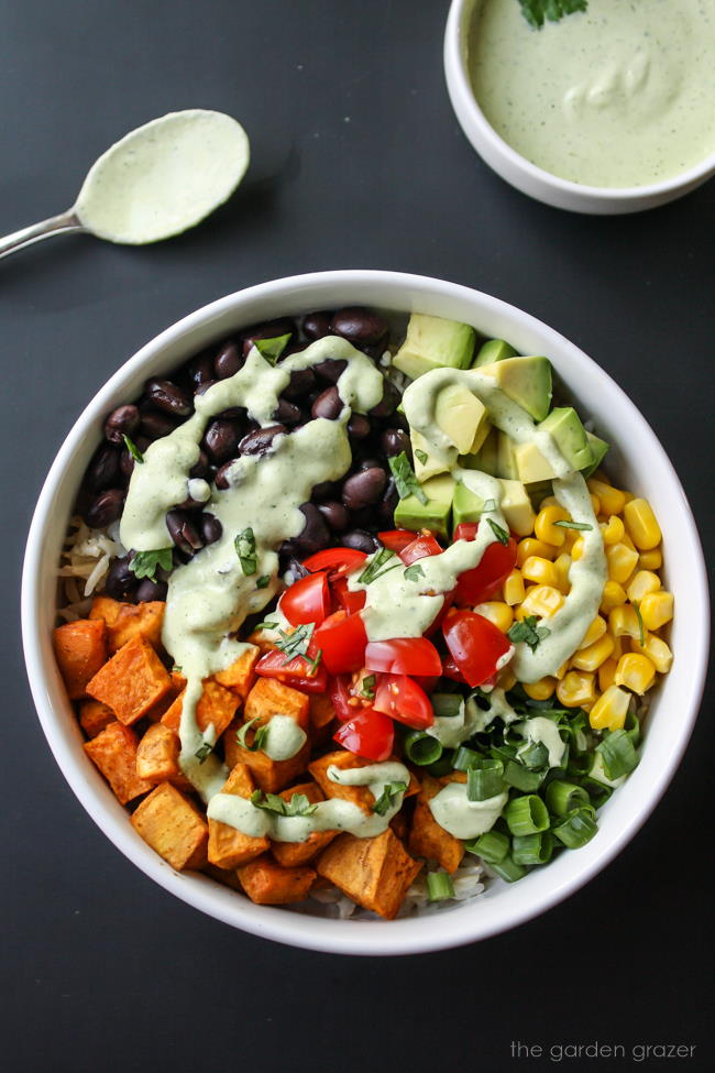 Black bean sweet potato bowl with cashew lime cream on top