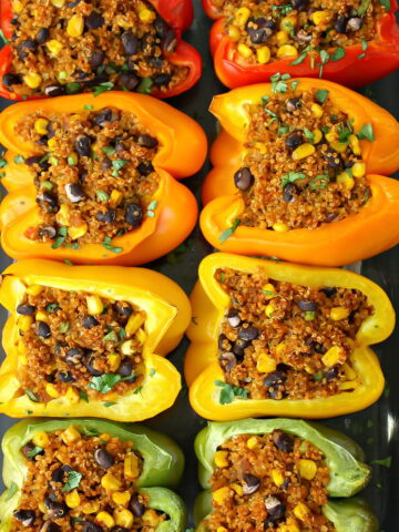 Quinoa stuffed peppers in a glass baking dish