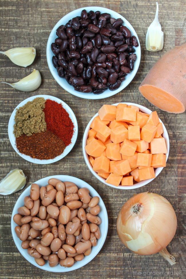 Ingredients on a wooden table for sweet potato chili