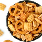 Vegan chex mix with pretzels in a small bowl