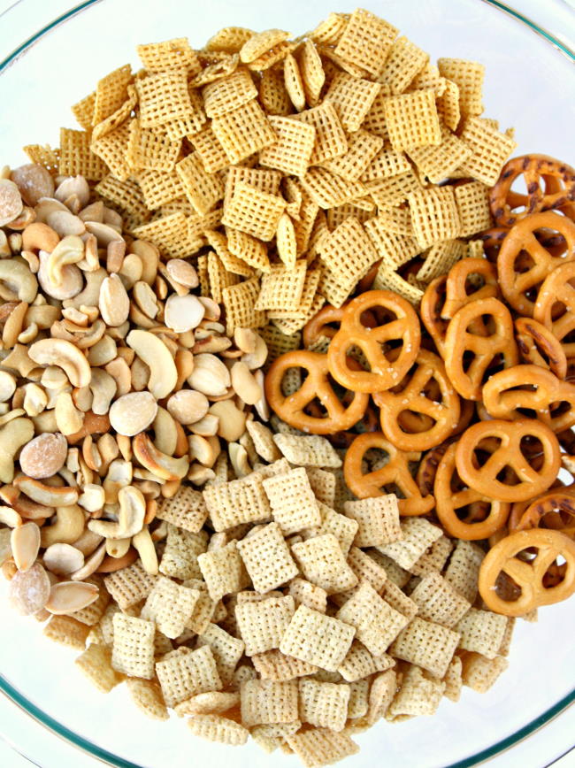 Vegan chex mix ingredients in a bowl before mixing