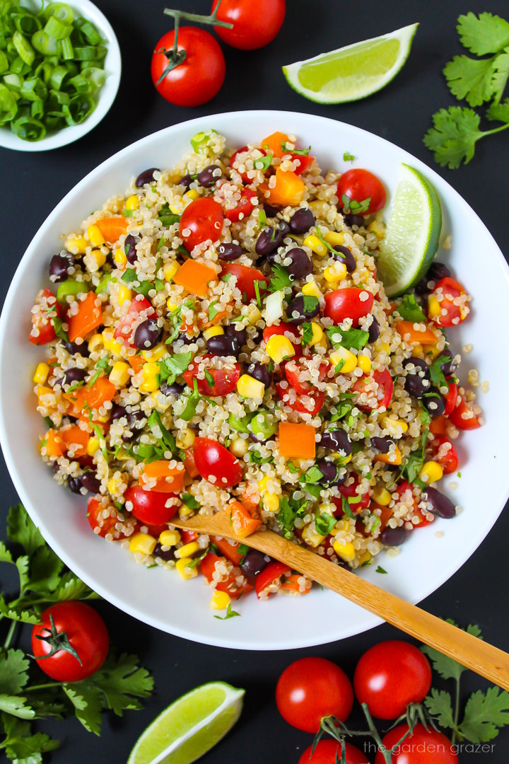 Overhead view of Mexican Quinoa Salad with cumin lime dressing on a white plate
