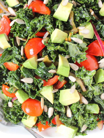 Marinated kale salad on a white plate