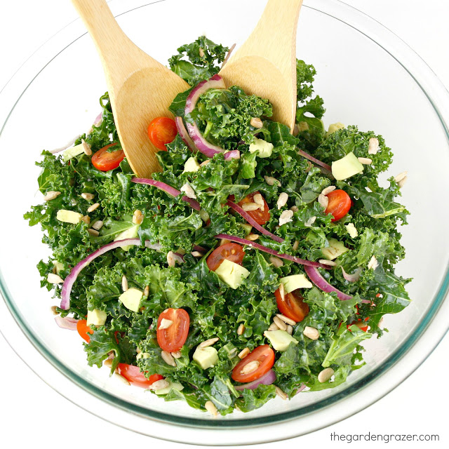 Bowl of marinated kale salad with tomato