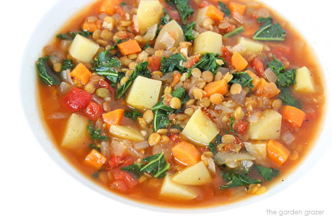 Vegan kale and potato soup with lentils in a bowl