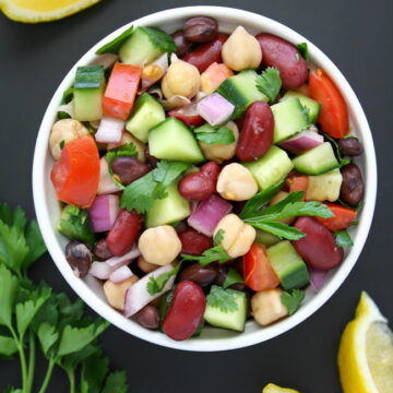 Mediterranean bean salad with herbs and lemon in a small bowl