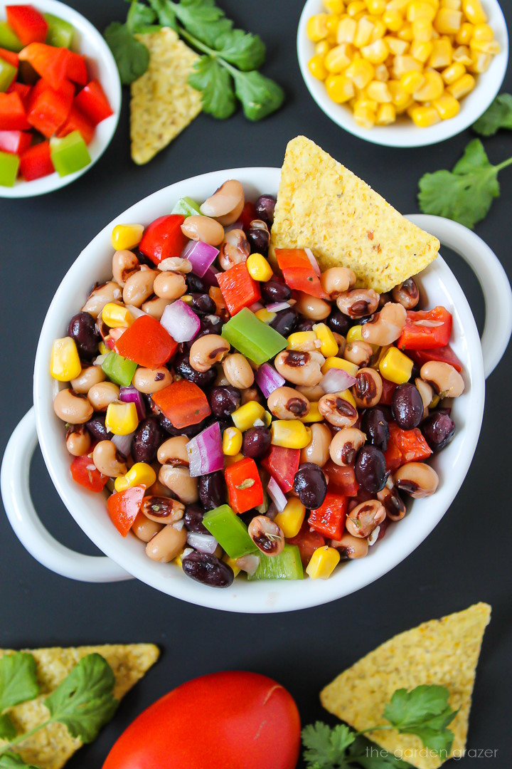 Overhead view of vegan cowboy caviar in a serving bowl with tortilla chips