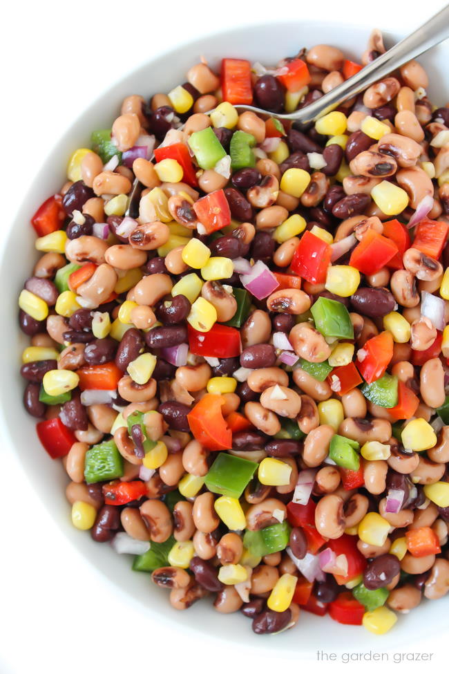 Healthy vegan cowboy caviar in a bowl with spoon