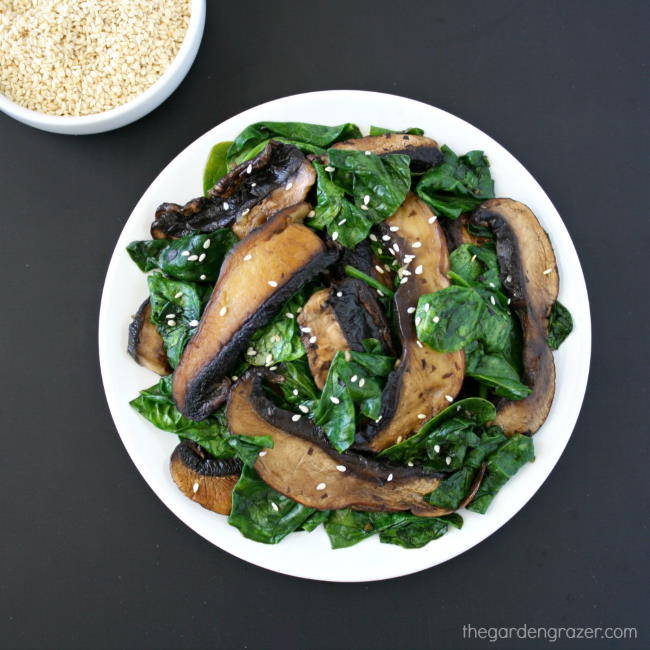 Plate of cooked portobellos with greens