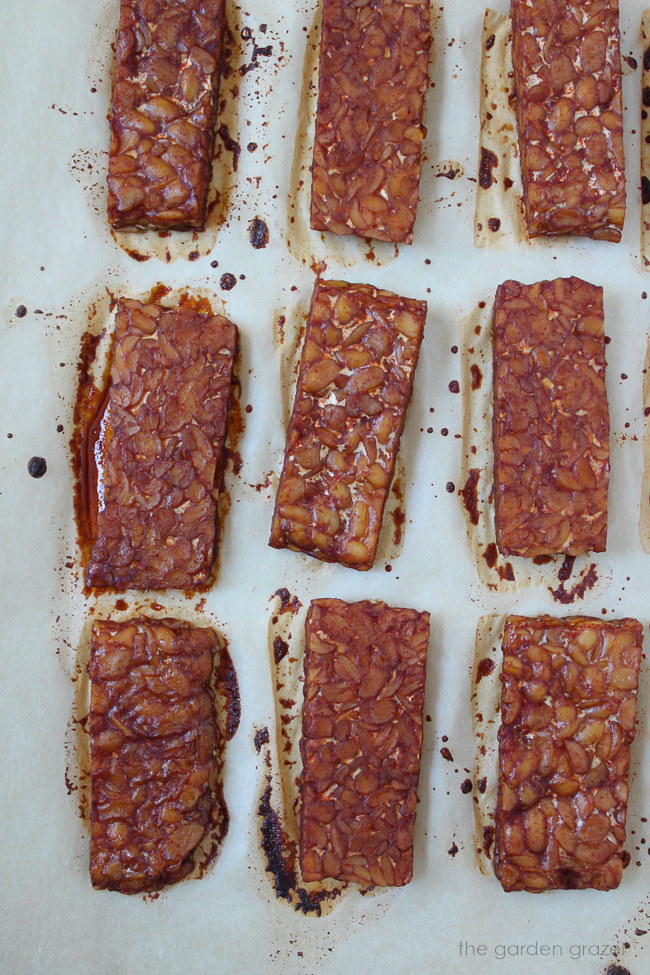 Baked tempeh bacon on a sheet pan