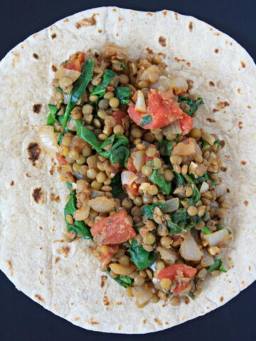 Lentil Spinach Burritos unwrapped showing the filling