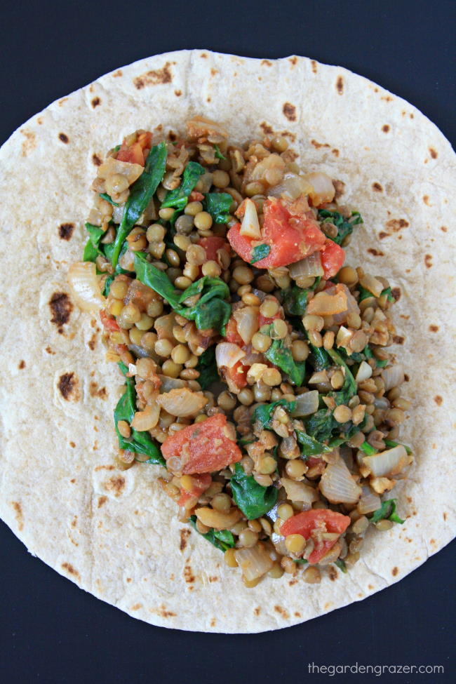 Lentil Spinach Burritos unwrapped showing the filling