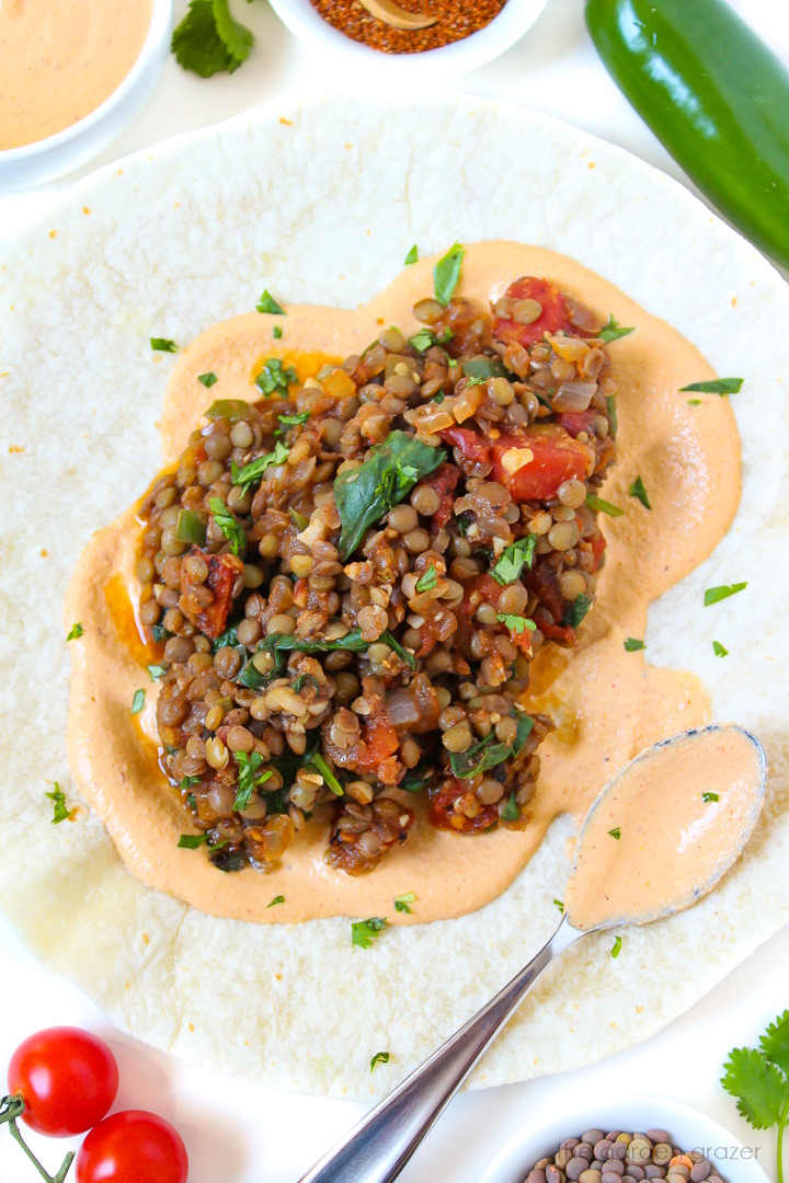Open-faced lentil spinach burritos with chipotle crema