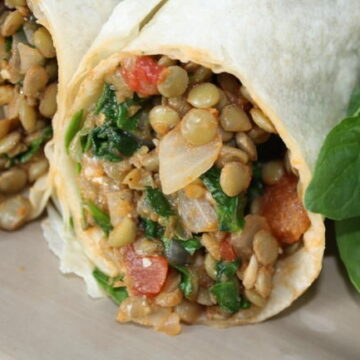 Lentil Spinach Burritos in a tortilla on a plate